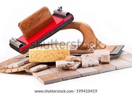Tiles, trowel, sponge, tool grinding walls on white background