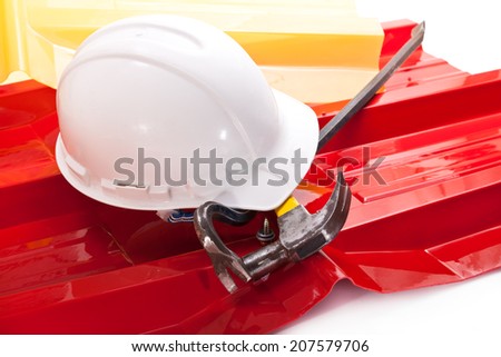 White working helmet, red and yellow plastic roof with acrylic coating, hammer and crowbar