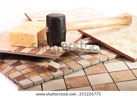 Mosaic tiles of marble and ceramics, rubber mallet, and sponge