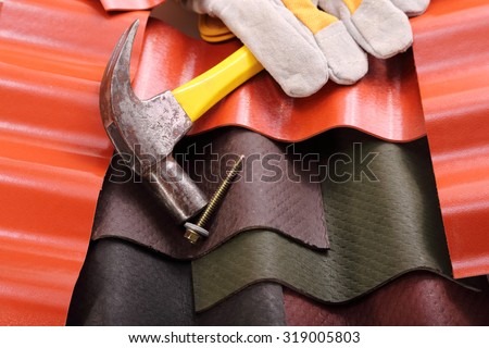 The roofs of various solid materials, a hammer and a screw fixing