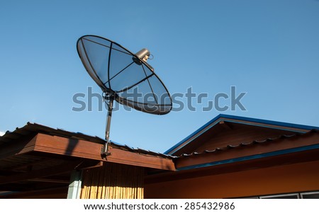 Satellite dish and TV antennas on the house roof