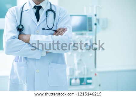 Doctor and advanced dialysis equipment in hospital background for commercial business
