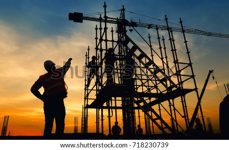Work Safety officer or Civil Engineer. team worker on background of construction site