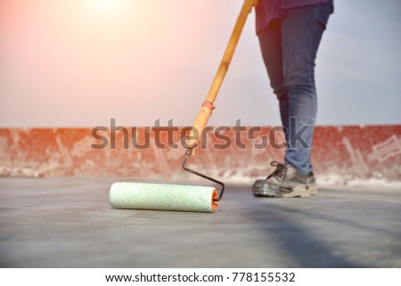 construction worker paint \
chemical water proof curing concrete slab