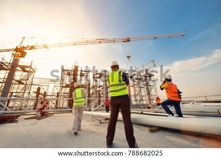 Civil engineer and safety officer inspection construction worker teamwork on scaffolding  election steel truss in construction site