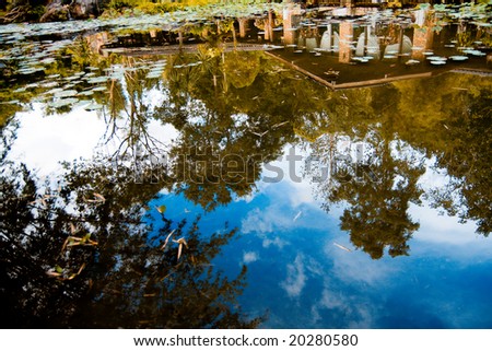 Reflection of small house in the park