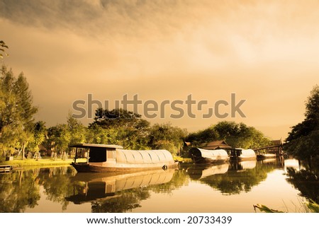 Boats in ancient city before sunset