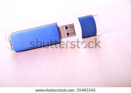 Blue USB flash drive on the table