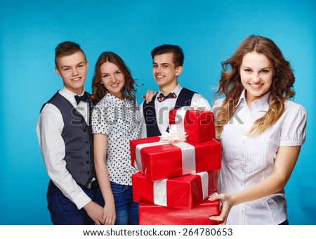 Businessman smile present gift red box in hand. With big group of Business people on background
