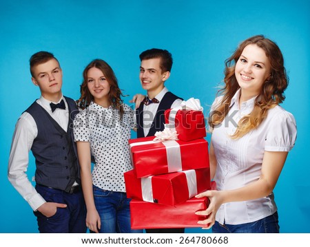 Businessman smile present gift red box in hand. With big group of Business people on background