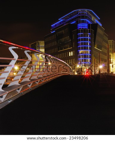 Perspective view from the bridge on a modern building in the night. Berlin, Germany, Mitte district.