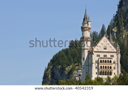 Neuschwanstein Castle in Germany built by King Ludwig II of Bavaria. Clear blue sky for copy space.