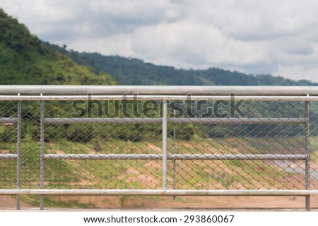 Steel fence grid pattern.