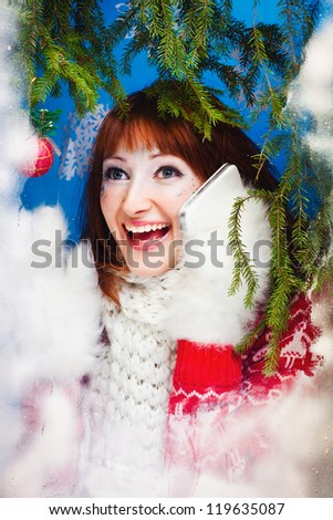 beautiful woman in warm clothing with white mitten