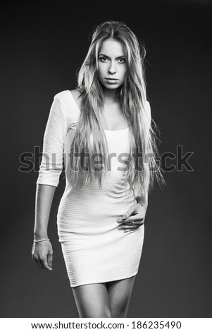 Young woman studio fashion portrait. Black and white.