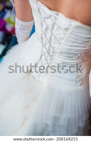 Image of back of bride in wedding dress