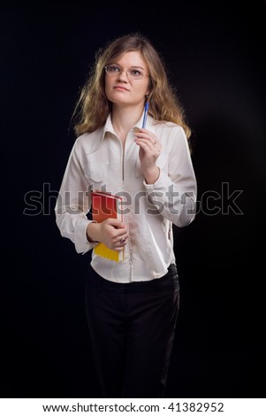 Young student woman. Over black background