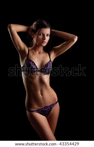 Perfect nude girl torso. On black background