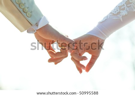 stock photo : Close-up Holding Hands with Wedding Ring