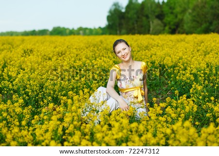 happy woman on yellow field