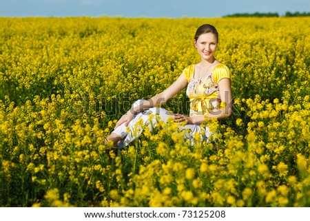 happy woman on yellow field