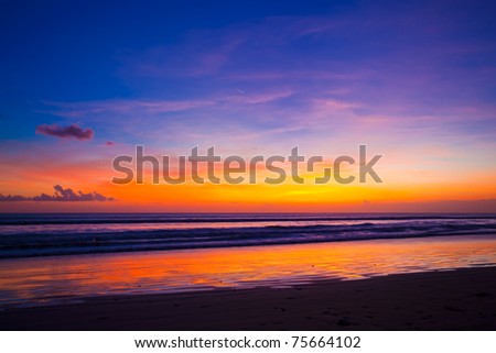 Tropical sunset on the beach. Bali island. Indonesia
