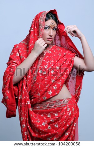 young pretty woman in indian red sari
