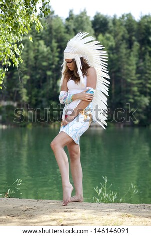 Young woman in costume of American Indian