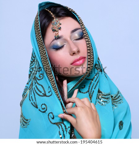 young pretty woman in indian turquoise sari