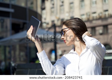 Young Beautiful business woman reading notepad