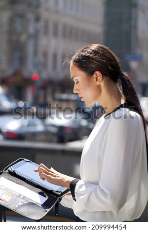 Young Beautiful business woman reading notepad