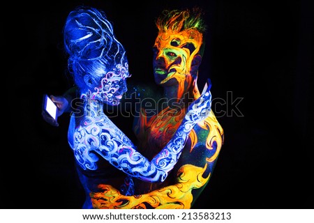 Body art glowing in ultraviolet light,  four elements, Air against Fire