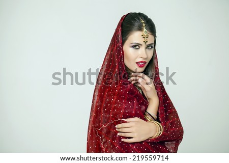 Young beautiful brunette woman in indian dress