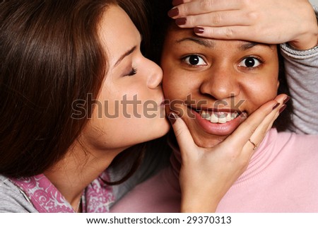 stock-photo-friendly-kiss-in-a-cheek-29370313.jpg