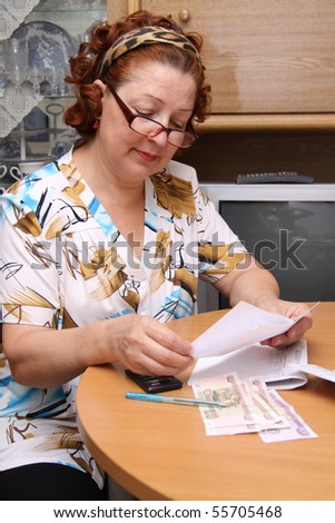 old woman counts money