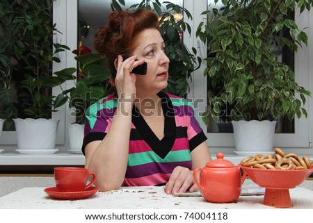 Closeup portrait of senior lady on landline phone call