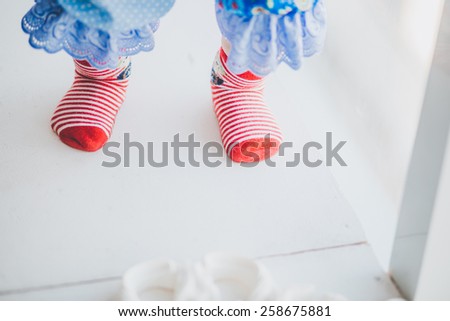red striped baby socks in a studio Christmas