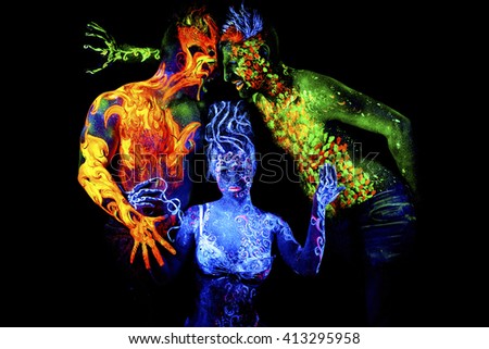 Fire, Land and Air. Body art glowing in ultraviolet light, four elements, isolated on black background