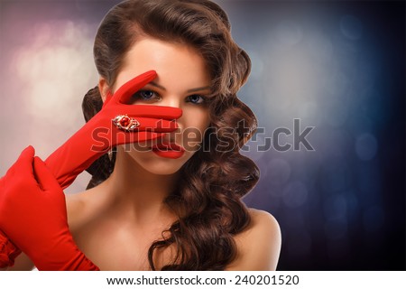Beauty Fashion Glamorous Model Girl Portrait. Vintage Style Mysterious Woman Wearing Red Glamour Gloves. Jewellery. Jewelry. Holiday Hairstyle and Make-up. Diamond Ring.