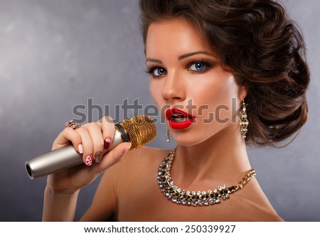 Singing Woman with Microphone.Glamour Singer Girl Portrait. Vintage Style. Karaoke Song