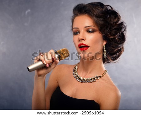 Karaoke Song.Singing Woman with Microphone.Glamour Singer Girl Portrait. Vintage Style.