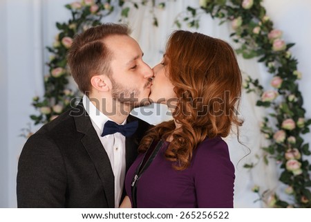girl and the guy kiss.Young affectionate couple kissing.Young man kisses his beautiful girlfriend