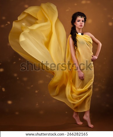 Fashion portrait of a beautiful girl in a flying dress.beauty portrait of a girl in the image of Egyptian Pharaoh Cleopatra