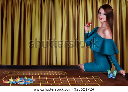 Girl playing in casino.Woman winning in a casino and playing with chips