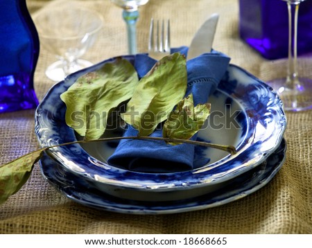 old blue painted plate with leaf