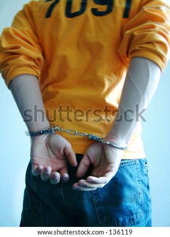 stock photo Journalistic photo of inmates handcuffed hands in jail