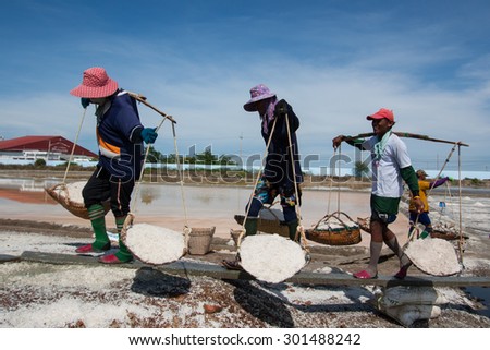 Samutsakhon,Thailand - May 17: Thai people keeping salt from Salt farming or Salt evaporation pond to godown on May 17 ,2015 in Samutsakhon Thailand.