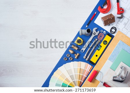 Home improvement and repair concept, plumbing work tools, tap, tiles and color swatches top view