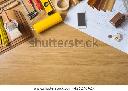Do it yourself home remodeling and renovation concept, work table top view with copyspace and tools top view