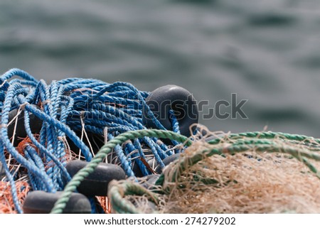 Fishing nets closeup. Background of fishing nets and floats. Fishing nets with sea background.